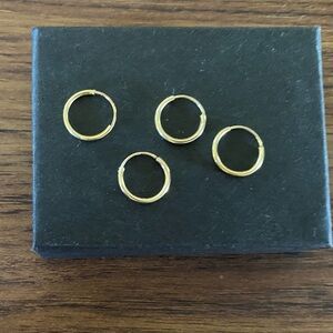 4 14k gold infinity hoop earrings. 10mm (.39 inches)